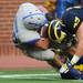 Air Force running back Cody Gets tumbles into the end zone for a touchdown in the fourth quarter at Michigan Stadium on Saturday. Melanie Maxwell I AnnArbor.com